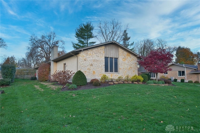 view of home's exterior featuring a yard