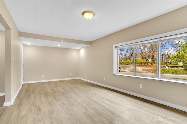 spare room with light hardwood / wood-style flooring