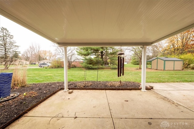 view of patio / terrace featuring a storage unit