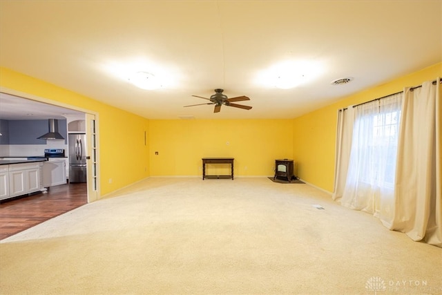 living room featuring ceiling fan and hardwood / wood-style floors