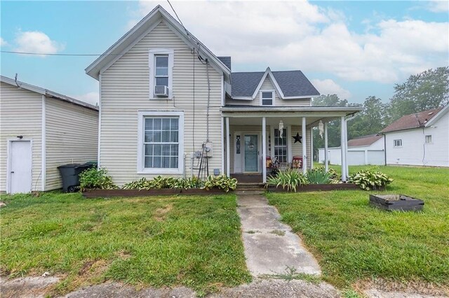 view of front facade with covered porch and a front yard