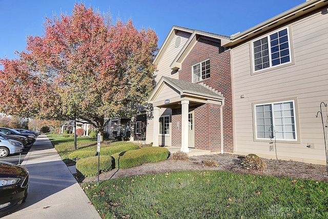 view of home's exterior with a yard