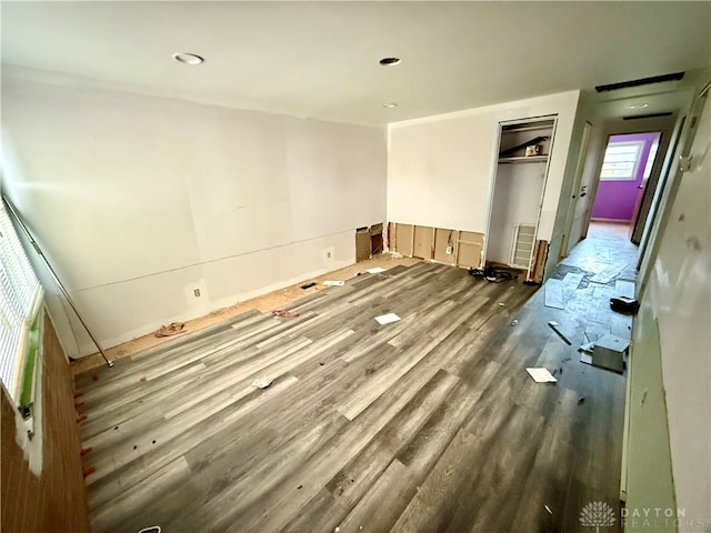 empty room with hardwood / wood-style floors