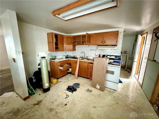 kitchen with backsplash, sink, and white range