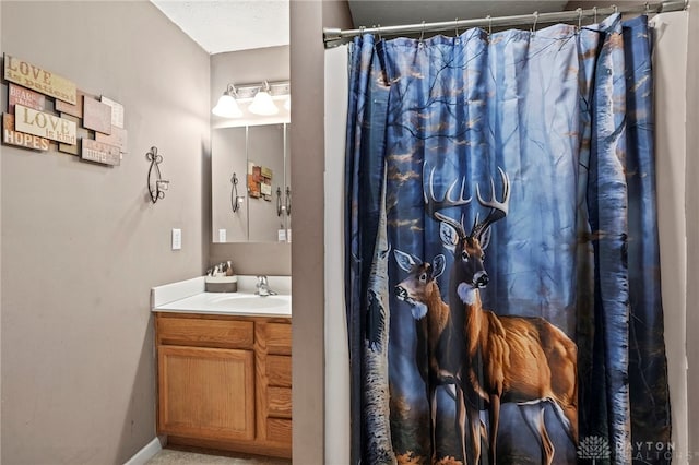 bathroom with a shower with curtain and vanity