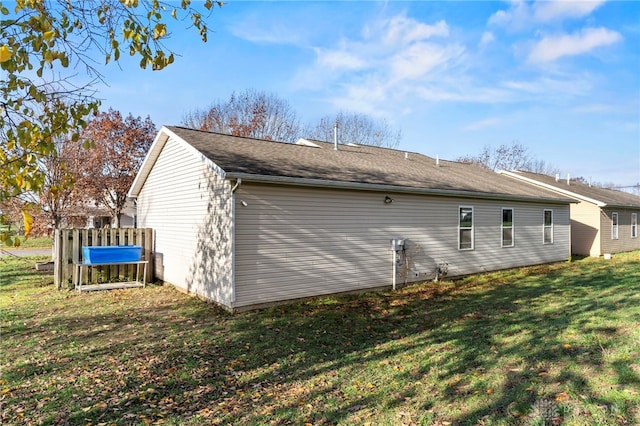 view of property exterior with a yard