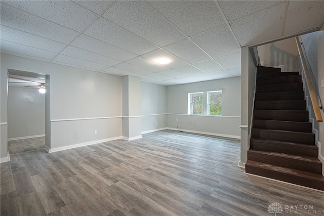 basement featuring hardwood / wood-style floors and a drop ceiling