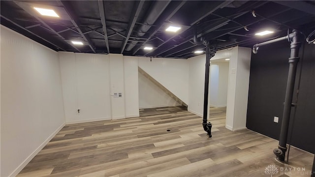 basement featuring hardwood / wood-style flooring