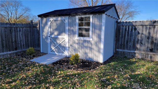 view of outdoor structure with a lawn