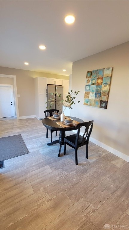 dining area with light wood-type flooring