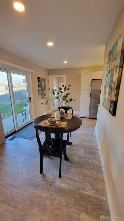 dining room featuring light hardwood / wood-style floors