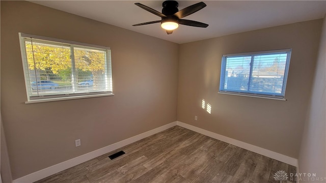 unfurnished room featuring ceiling fan and hardwood / wood-style flooring