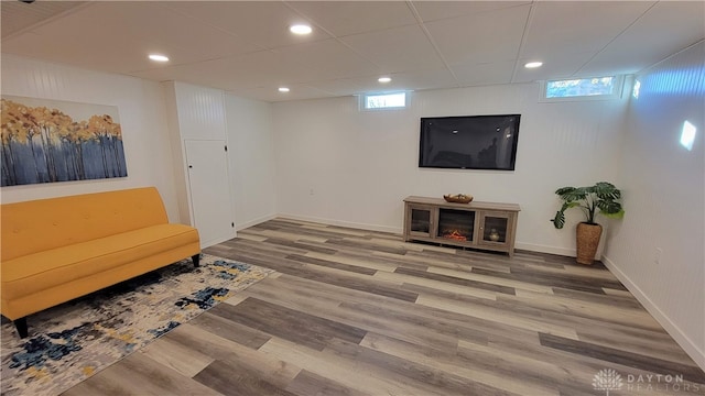 living area featuring a healthy amount of sunlight and hardwood / wood-style flooring