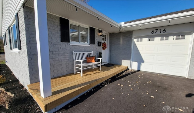 view of exterior entry featuring a garage