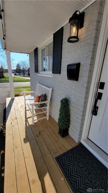 wooden terrace with covered porch