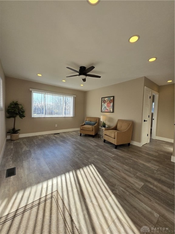 unfurnished room featuring ceiling fan and dark wood-type flooring