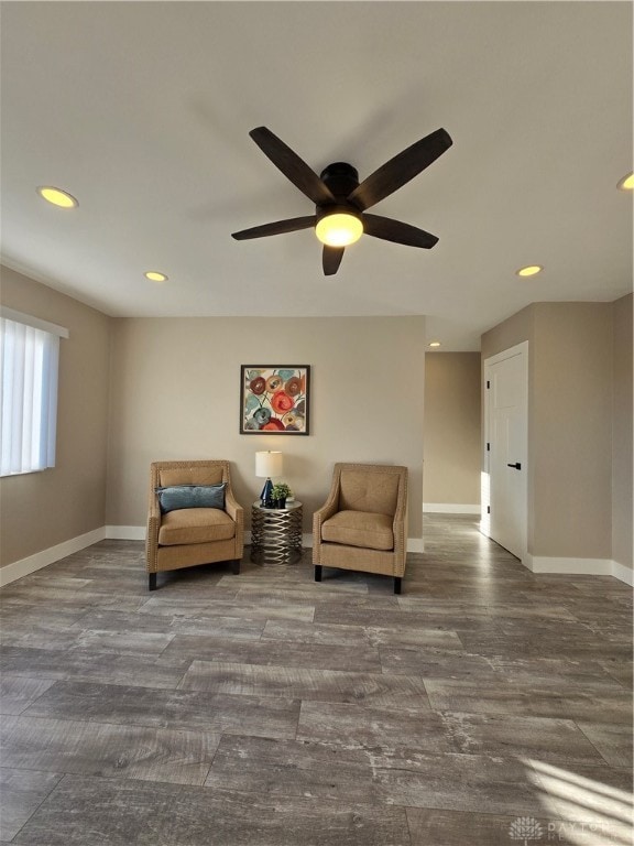 sitting room featuring ceiling fan