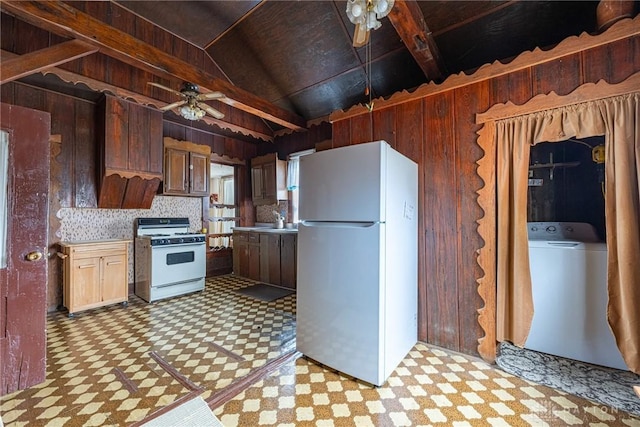 8 W Walnut St, Spring Valley, OH 45370 - kitchen featuring white appliances, ceiling fan, wood walls, light floors, and washer / clothes dryer