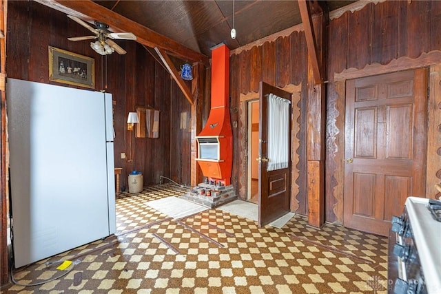 8 W Walnut St, Spring Valley, OH 45370 - kitchen featuring freestanding refrigerator, stainless steel range oven, tile patterned floors, wooden walls, and a ceiling fan