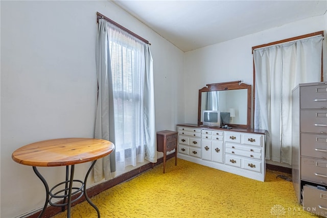 sitting room featuring light colored carpet