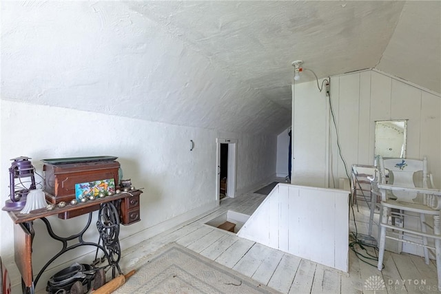 8 W Walnut St, Spring Valley, OH 45370 - additional living space featuring vaulted ceiling, a textured ceiling, and wood finished floors