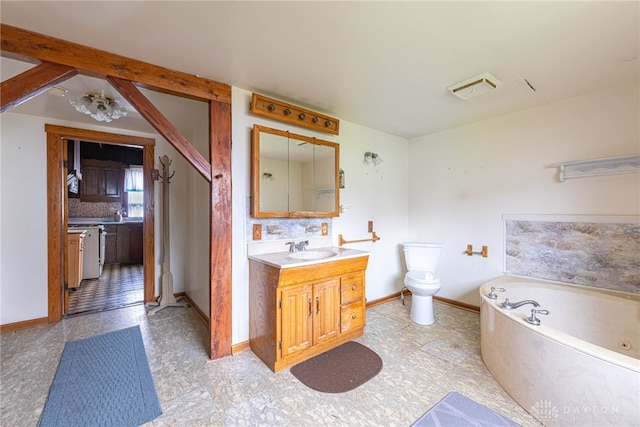 bathroom featuring a bathing tub, decorative backsplash, toilet, and vanity