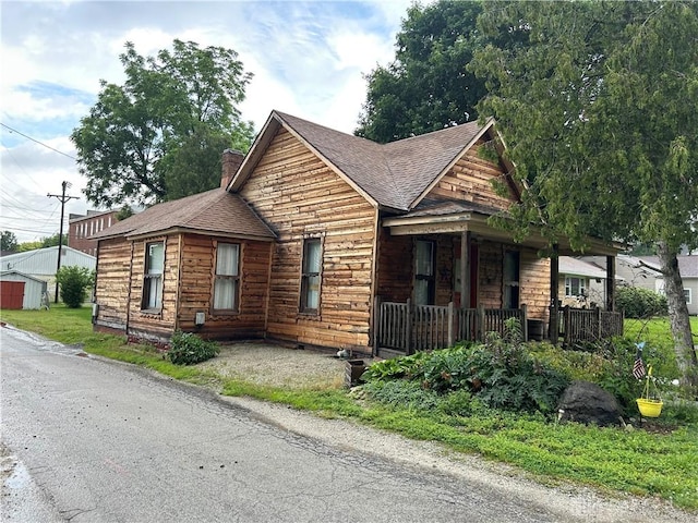 8 W Walnut St, Spring Valley, OH 45370 - view of front of property with roof with shingles, a porch, and a chimney