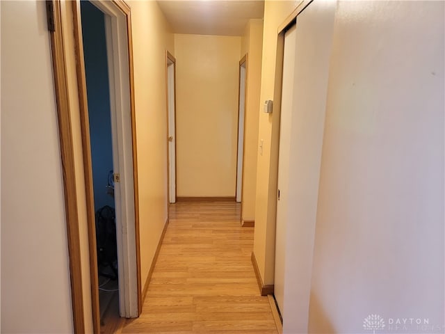 hallway with light wood-type flooring