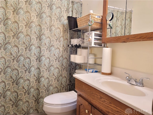 bathroom with vanity and toilet