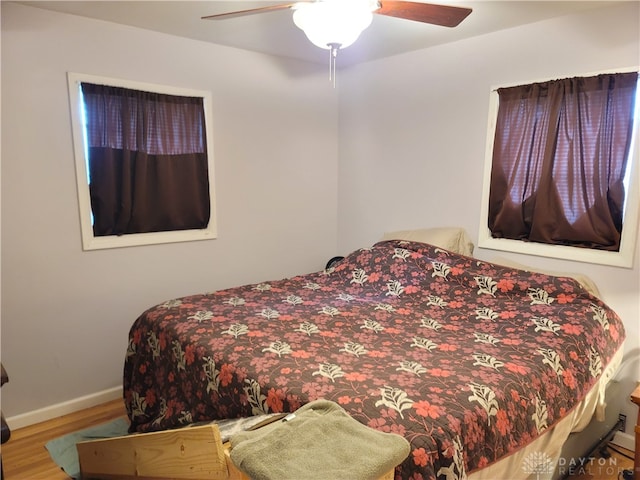 bedroom featuring hardwood / wood-style flooring and ceiling fan