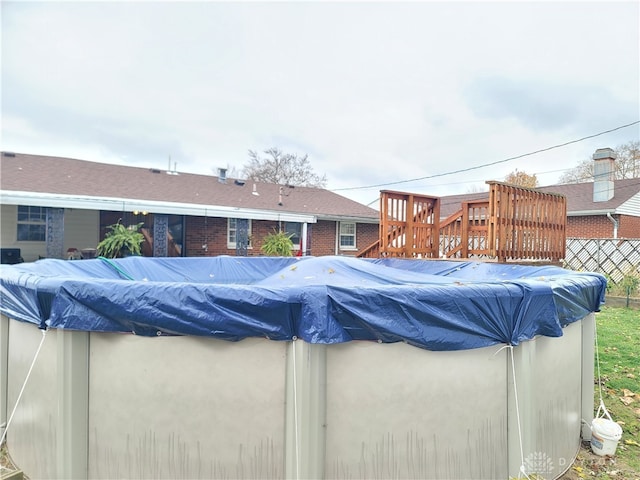 view of pool with a wooden deck