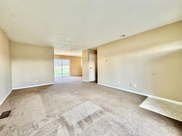 empty room with carpet flooring