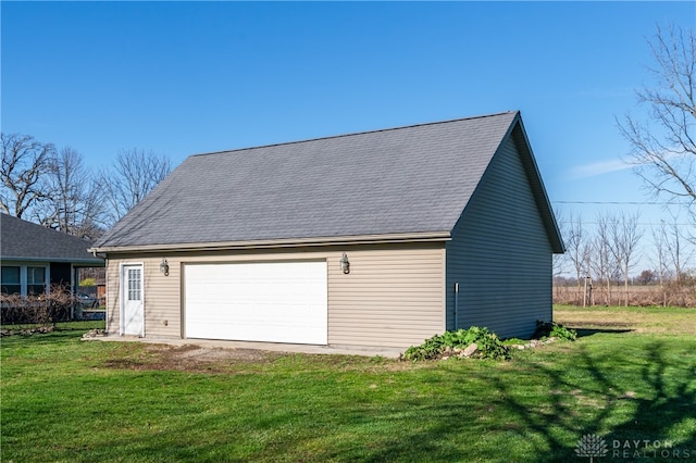 garage featuring a yard