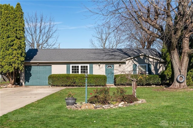 ranch-style home featuring a garage and a front yard