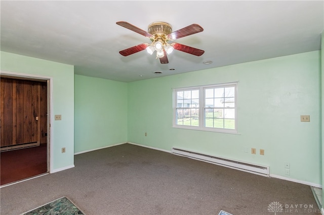 carpeted empty room featuring ceiling fan and a baseboard heating unit