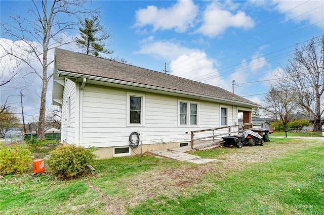 view of property exterior with a yard