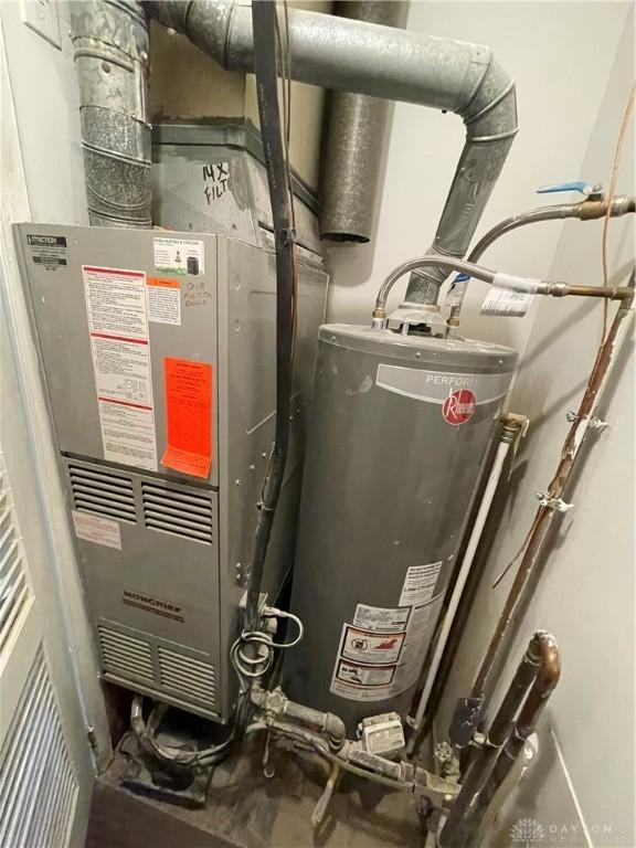 utility room with gas water heater