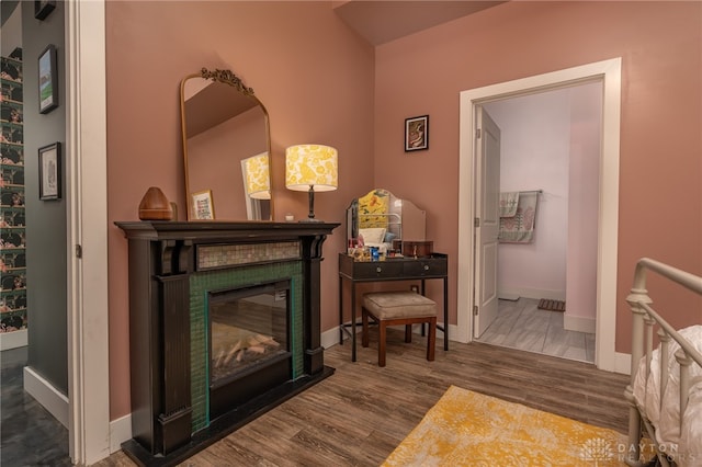 living area with a fireplace and hardwood / wood-style flooring