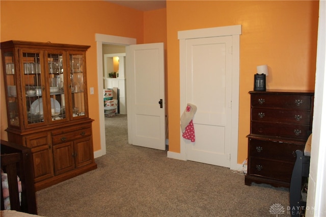 bedroom featuring dark carpet