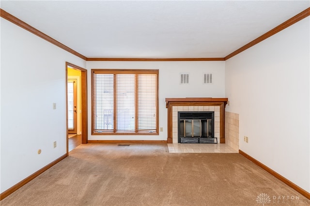 unfurnished living room with light carpet, a fireplace, and crown molding