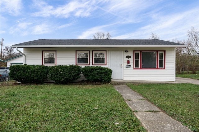 ranch-style house with a front lawn