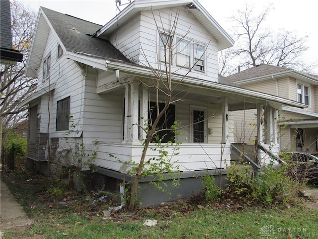 view of property exterior featuring a porch