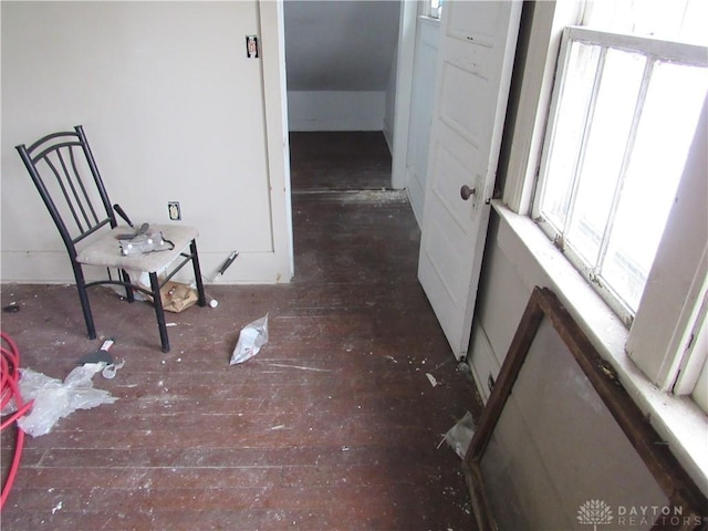 corridor featuring dark wood-type flooring