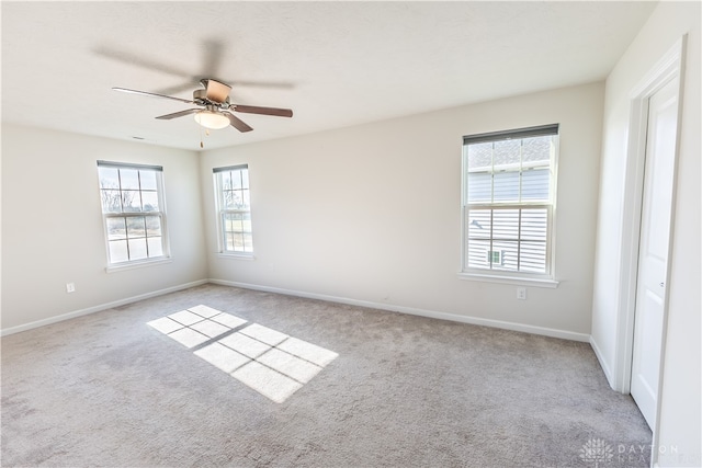 carpeted empty room with ceiling fan