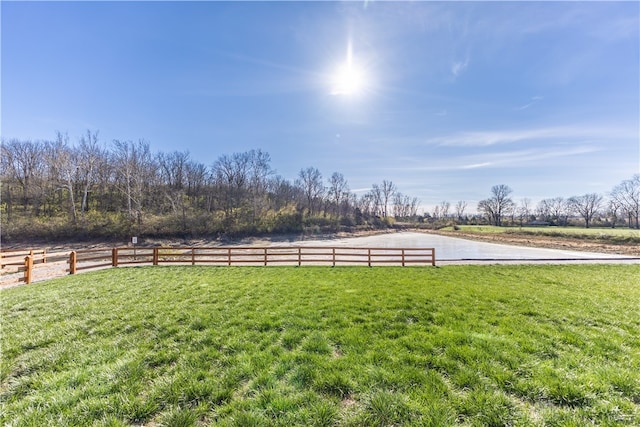 view of yard with a rural view