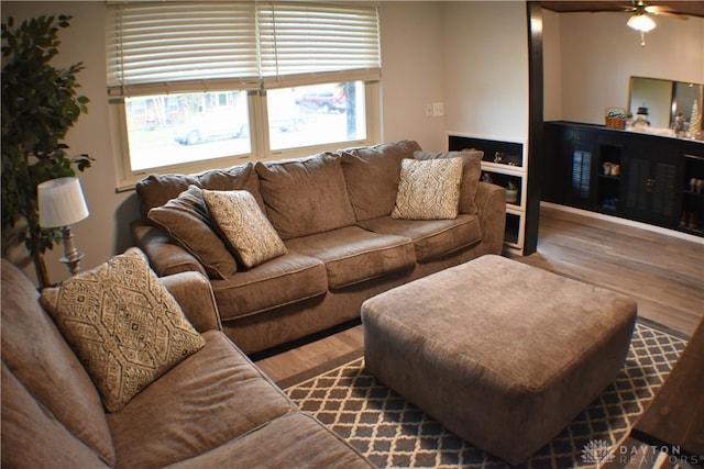 living room with ceiling fan and wood-type flooring