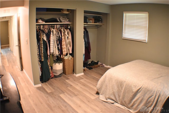 bedroom with hardwood / wood-style floors