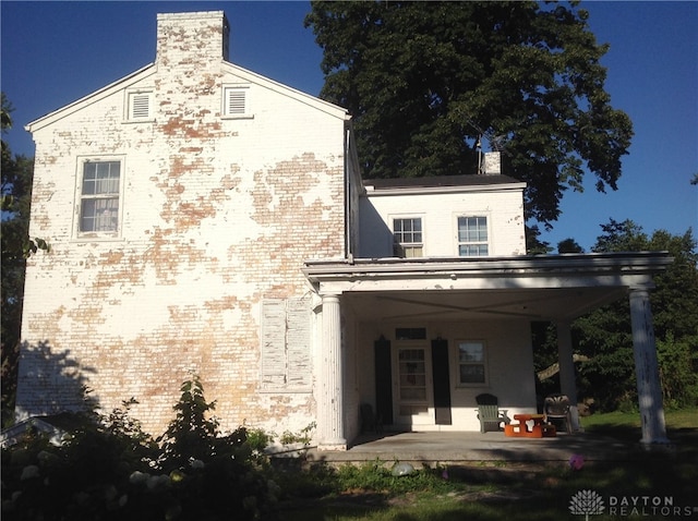 rear view of house featuring a patio