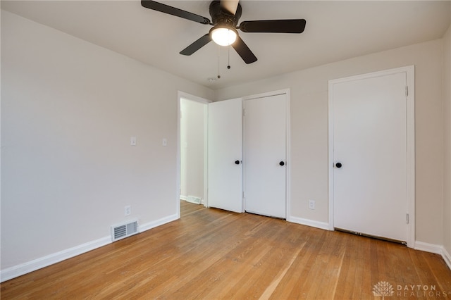 unfurnished bedroom featuring ceiling fan and light hardwood / wood-style floors