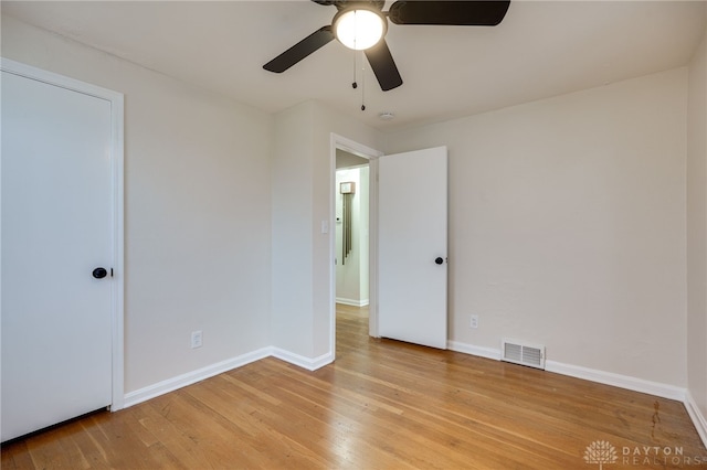 spare room featuring ceiling fan and light hardwood / wood-style floors